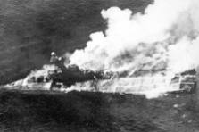 HMS Hermes ablaze and sinking